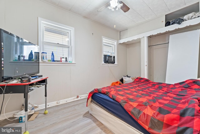 bedroom featuring a closet, ceiling fan, and hardwood / wood-style flooring