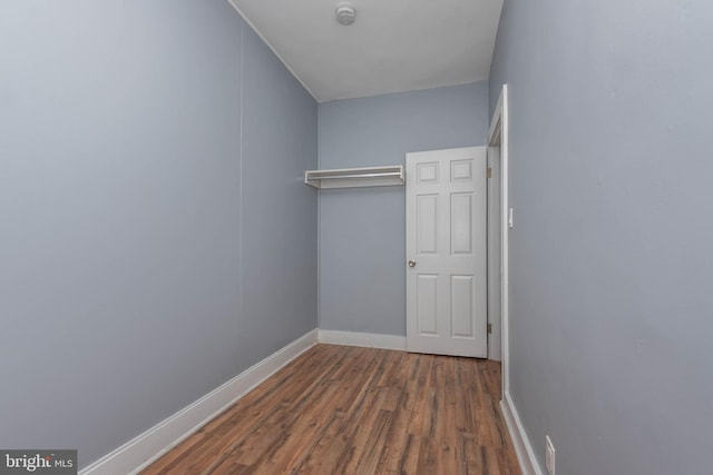 walk in closet featuring dark hardwood / wood-style flooring