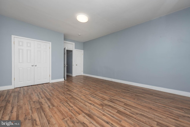 unfurnished bedroom with wood-type flooring