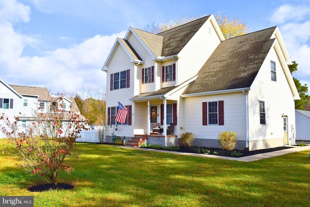 view of front of house featuring covered porch, central AC, and a front lawn