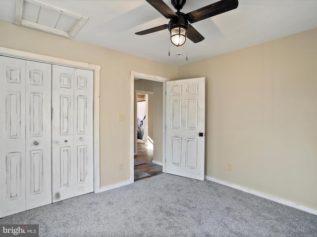 unfurnished bedroom with carpet flooring, ceiling fan, and a closet