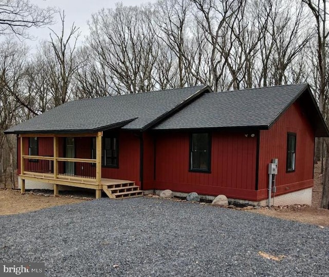 598 Honey Locust Ln, Great Cacapon, WV 25422 - rustic home featuring covered porch and roof with shingles