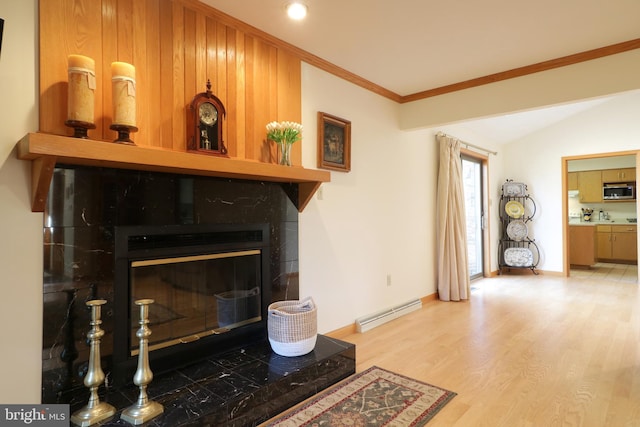 details featuring hardwood / wood-style flooring, ornamental molding, and a baseboard heating unit