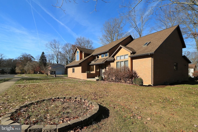 view of side of property featuring a lawn