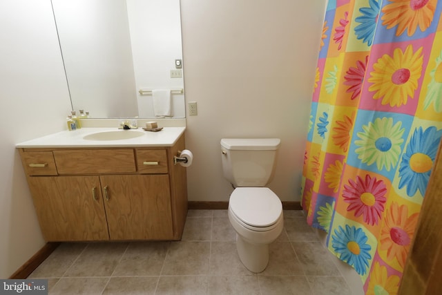 bathroom featuring tile patterned floors, vanity, toilet, and curtained shower