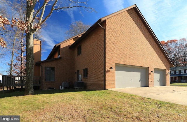 view of side of home with cooling unit, a garage, a lawn, and a deck