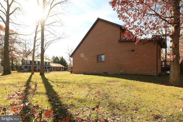 view of home's exterior featuring a lawn