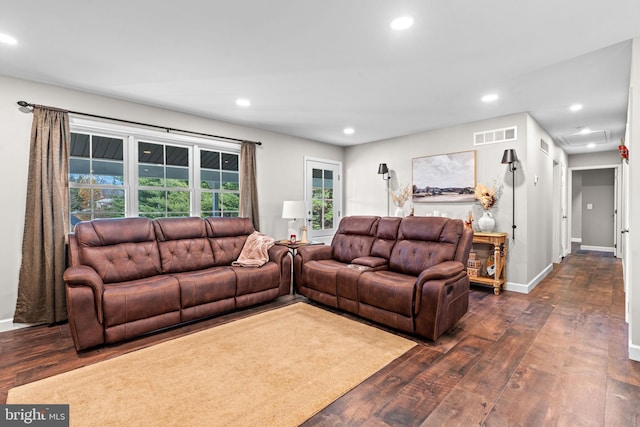 living room with dark hardwood / wood-style floors