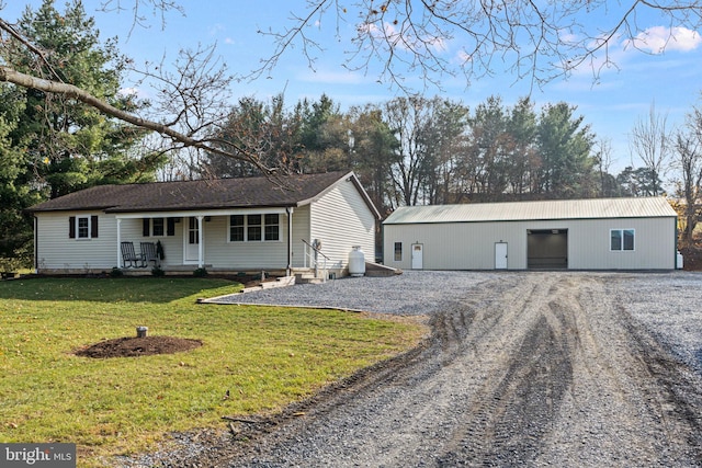 ranch-style house with a porch and a front lawn