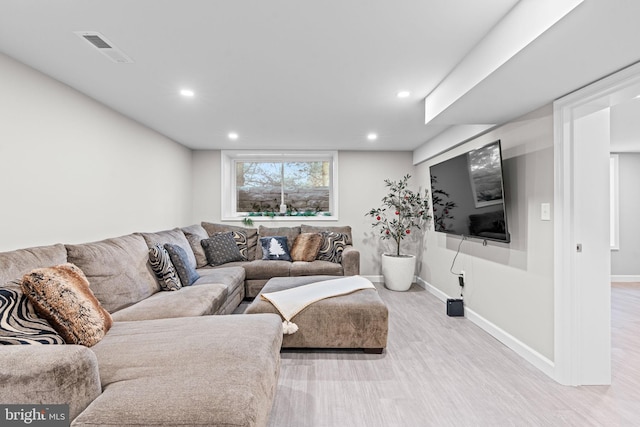 living room with light hardwood / wood-style flooring