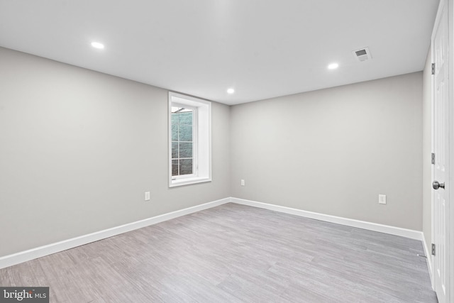 unfurnished room featuring light hardwood / wood-style floors