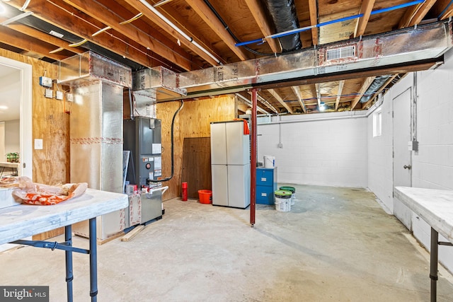 basement featuring white refrigerator