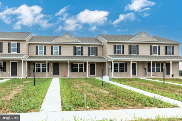 view of property with a front lawn