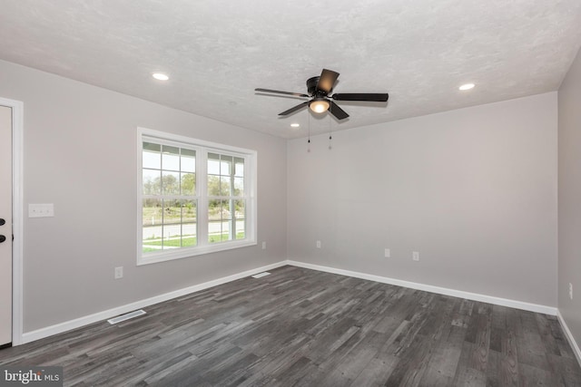 unfurnished room featuring baseboards, a ceiling fan, dark wood-style floors, and recessed lighting