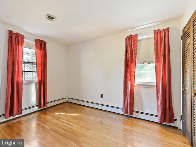 empty room with light wood-type flooring