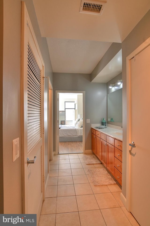 bathroom featuring tile patterned floors and vanity