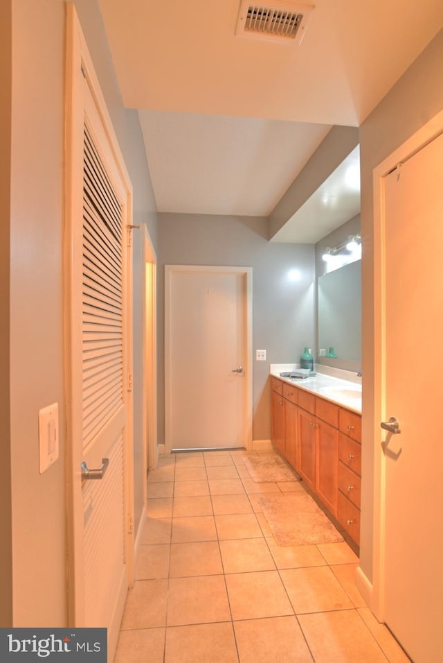 400 Massachusetts Ave NW Unit 423, Washington, DC 20001 - bathroom featuring tile patterned flooring, double vanity, and baseboards