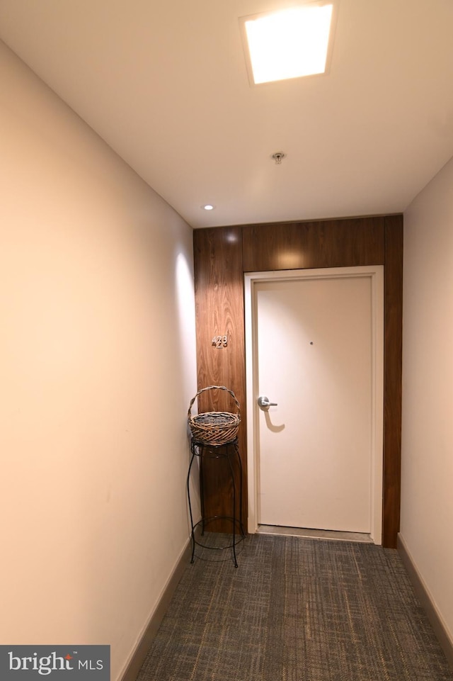 400 Massachusetts Ave NW Unit 423, Washington, DC 20001 - hallway featuring dark carpet, baseboards, and recessed lighting