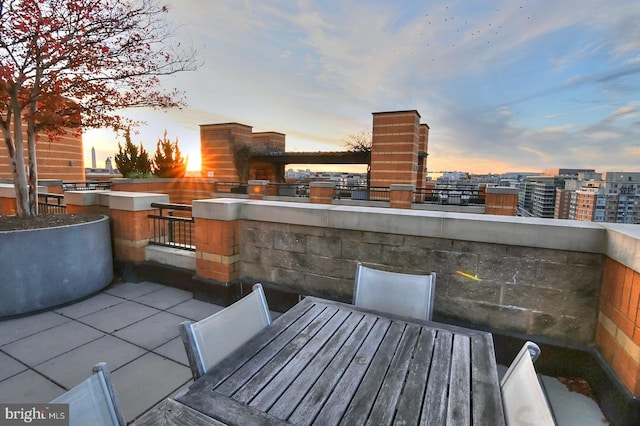 patio terrace at dusk with a water view