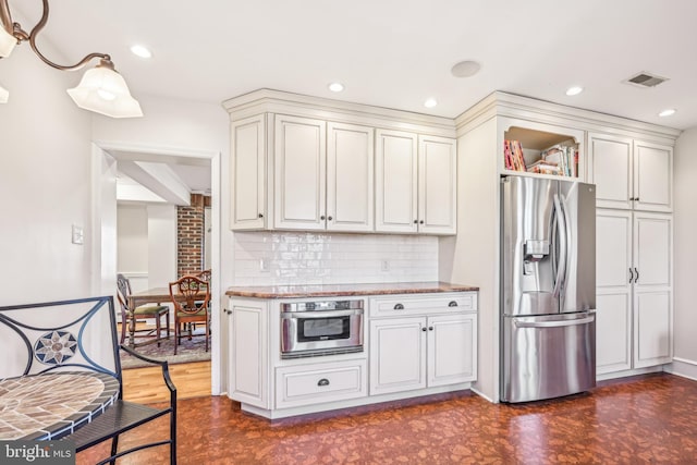 kitchen featuring tasteful backsplash, dark wood-type flooring, and stainless steel appliances