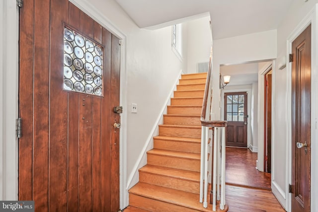 entryway with hardwood / wood-style flooring