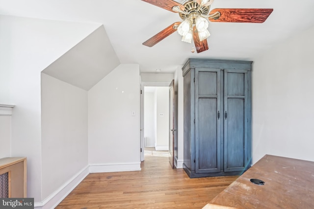 bonus room with ceiling fan, lofted ceiling, and light wood-type flooring