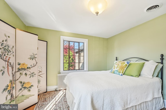 bedroom with radiator heating unit