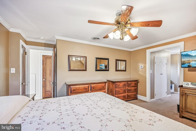 carpeted bedroom featuring ceiling fan and ornamental molding