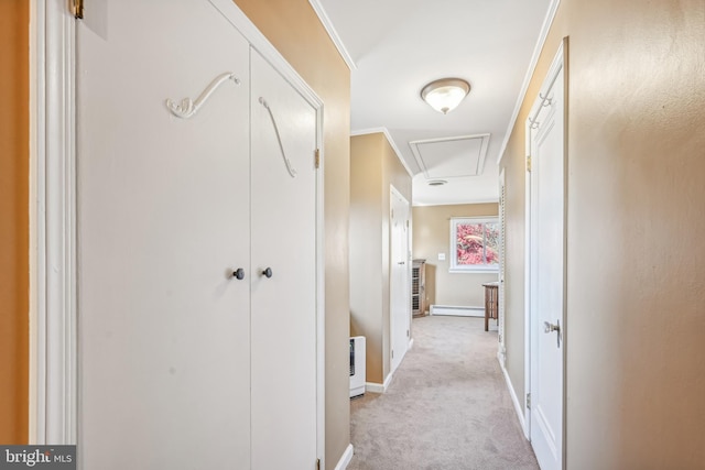 hallway featuring crown molding, light carpet, and a baseboard heating unit