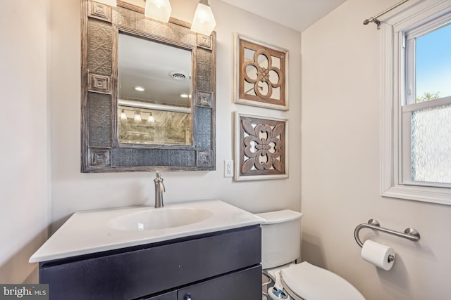 bathroom with vanity and toilet