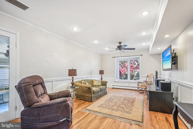 living room with crown molding, ceiling fan, light hardwood / wood-style floors, and a baseboard radiator