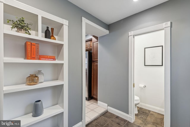 hallway with built in shelves