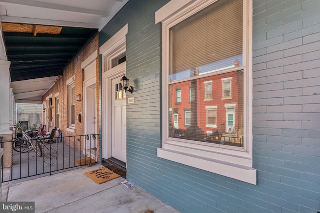 property entrance featuring covered porch