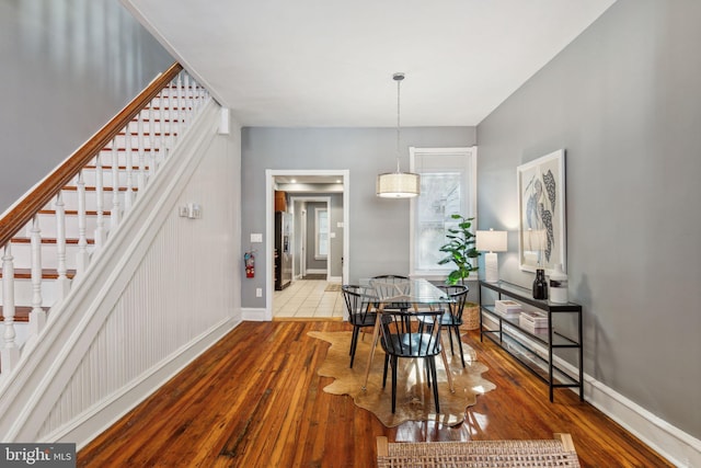 dining area with wood-type flooring