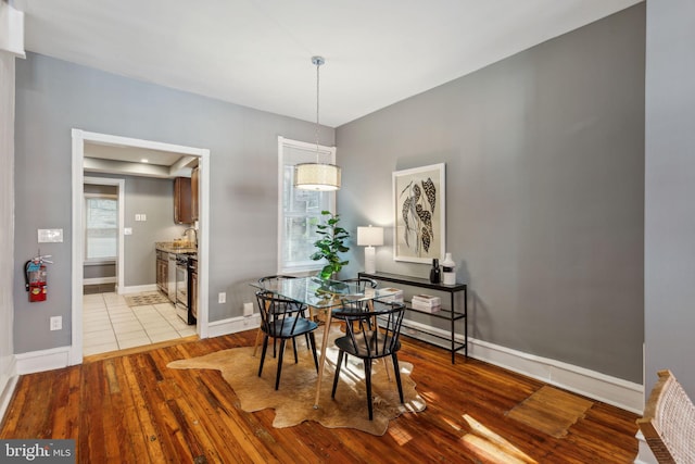 dining space featuring light wood-type flooring