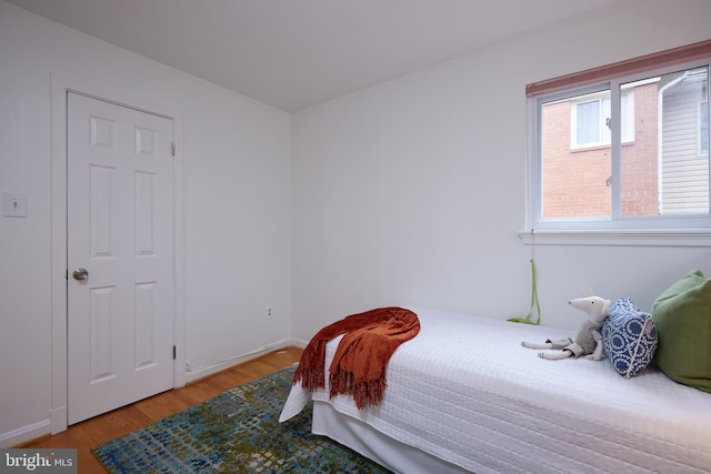 bedroom with light wood-type flooring