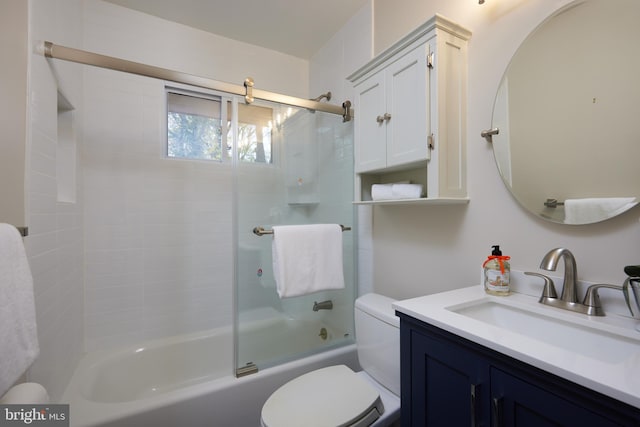 full bathroom featuring shower / bath combination with glass door, vanity, and toilet