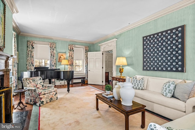 living room with a premium fireplace and crown molding