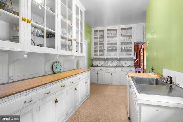 kitchen featuring white cabinets