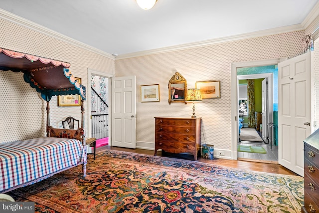 bedroom featuring crown molding and hardwood / wood-style floors