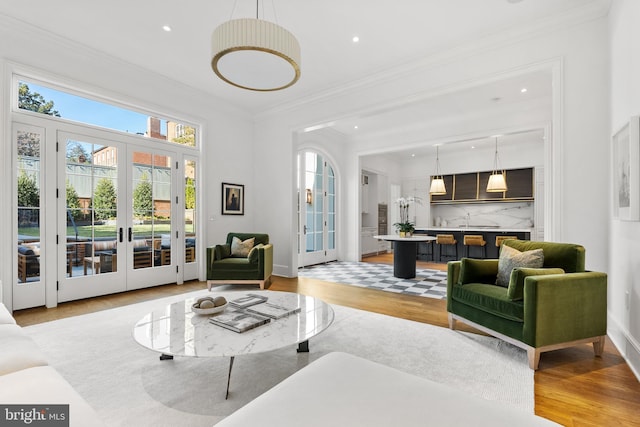 1524 33rd St NW, Washington, DC 20007 - living area featuring light wood-style flooring, ornamental molding, french doors, and recessed lighting