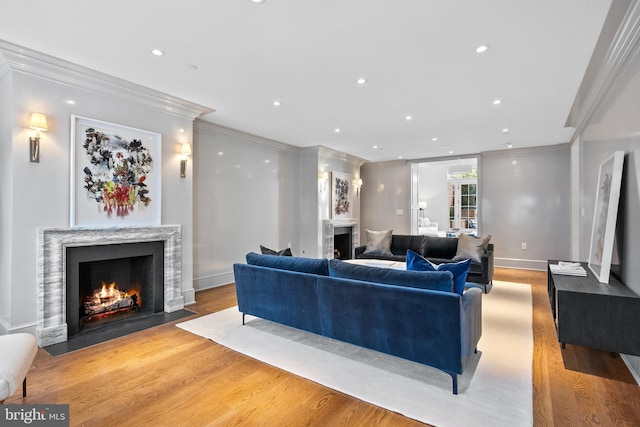 1524 33rd St NW, Washington, DC 20007 - living area with a fireplace, crown molding, light wood-style floors, and recessed lighting