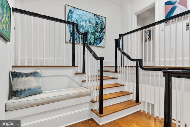 1524 33rd St NW, Washington, DC 20007 - stairway featuring wood finished floors and ornamental molding