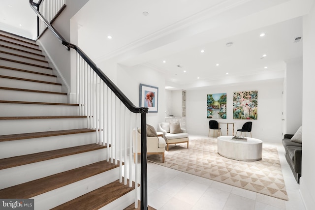 living room featuring crown molding