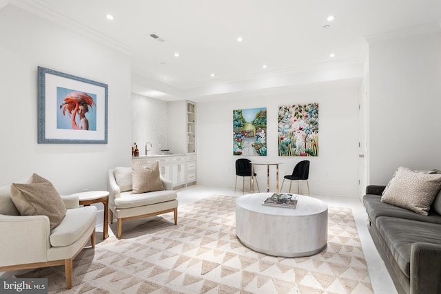 living room featuring built in features and crown molding