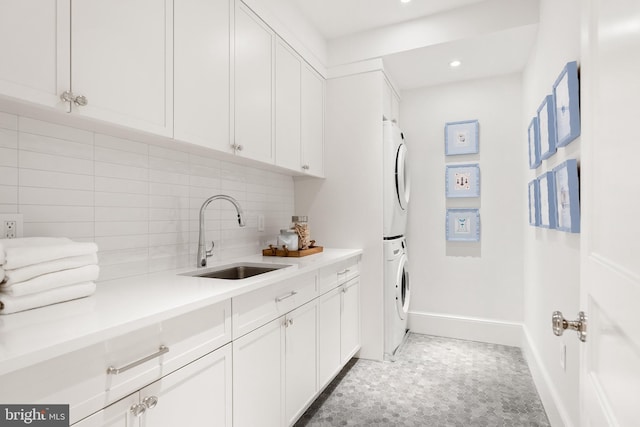1524 33rd St NW, Washington, DC 20007 - washroom featuring cabinet space, stacked washer and clothes dryer, and recessed lighting
