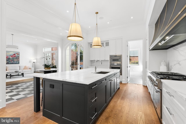 1524 33rd St NW, Washington, DC 20007 - kitchen with a sink, appliances with stainless steel finishes, wall chimney range hood, white cabinets, and dark cabinetry