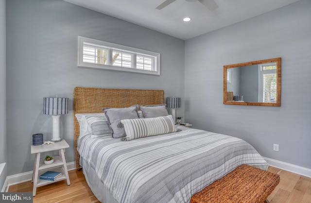 bedroom featuring light hardwood / wood-style flooring and ceiling fan