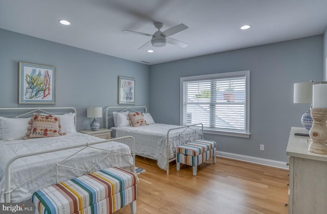 bedroom featuring light wood-type flooring and ceiling fan