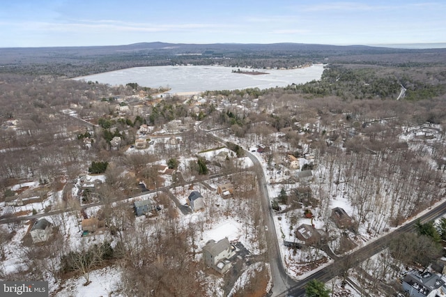 snowy aerial view featuring a mountain view